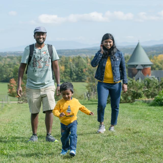 Couple with their child near Farm Barn