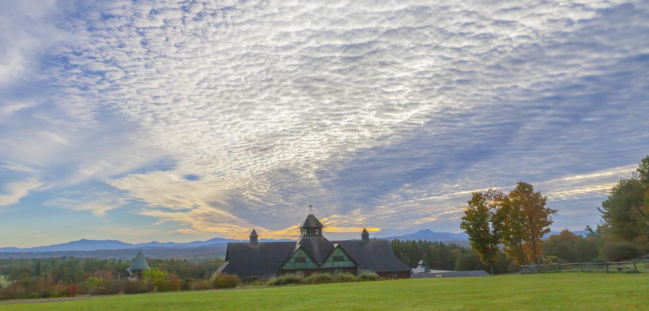 mackerel sky in the morning behind the Farm Barn