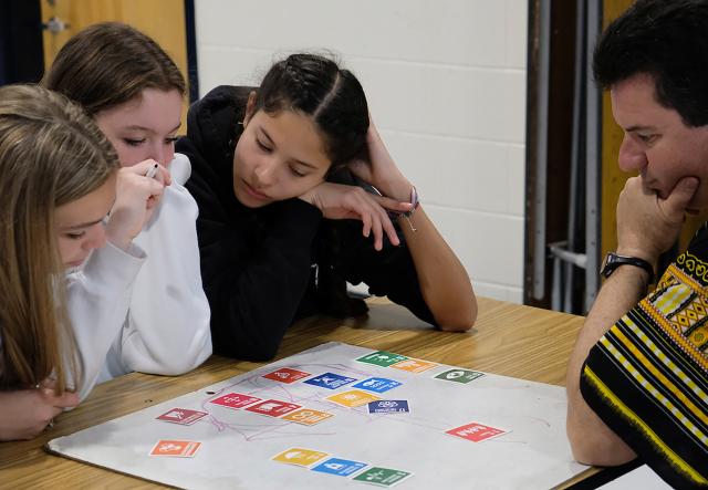 Students gathered around a table